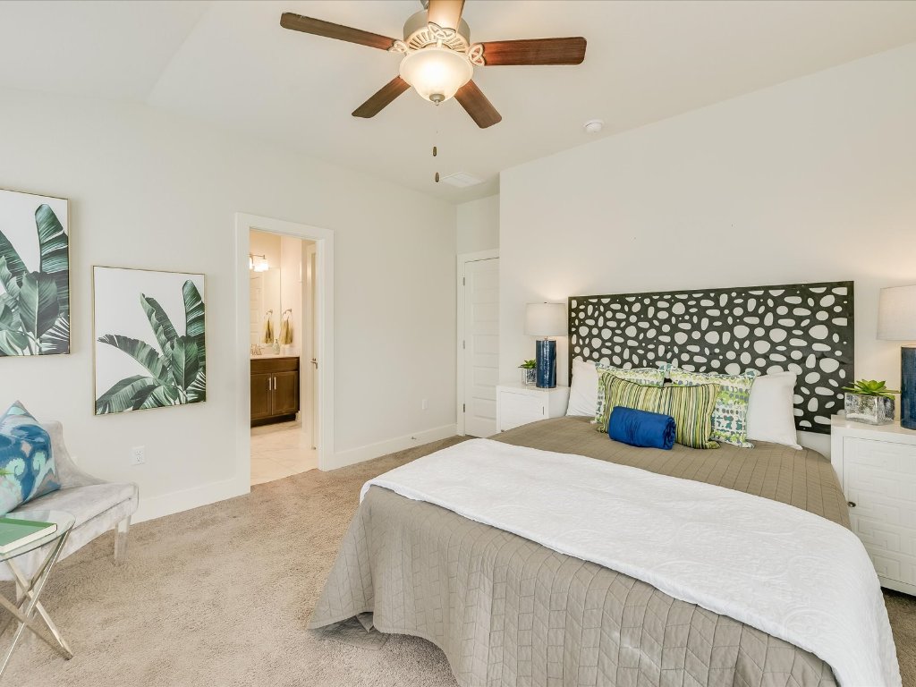 1916 Warely Lane Austin, TX 78741 - Photo 9 of 15 a bedroom with a bed and a chandelier