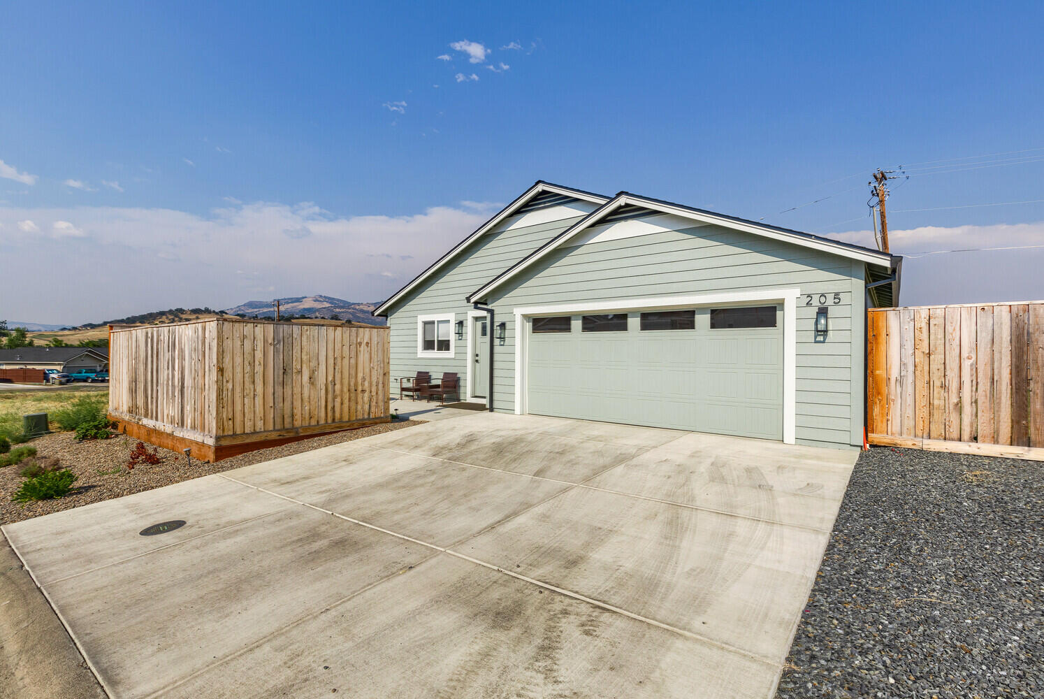 205 Suncrest Road Talent, OR 97540 - Photo 31 of 32 a front view of a house with a garage