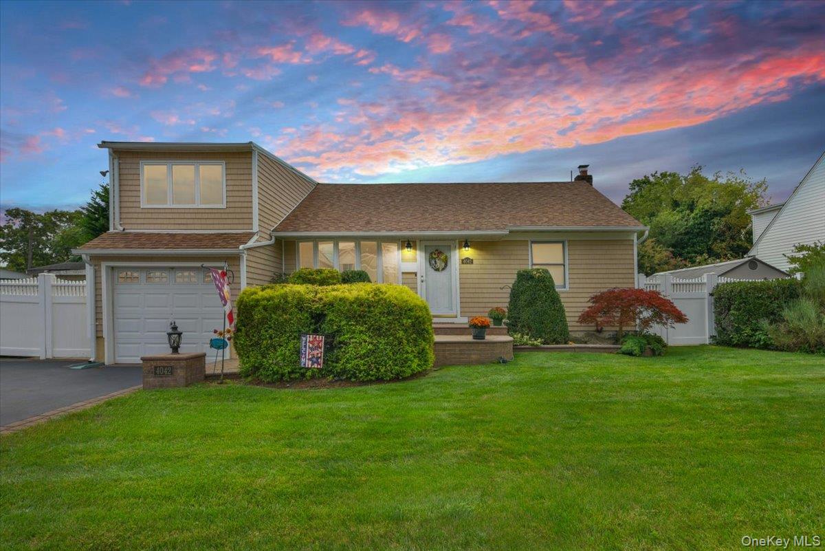 a view of a house with a backyard