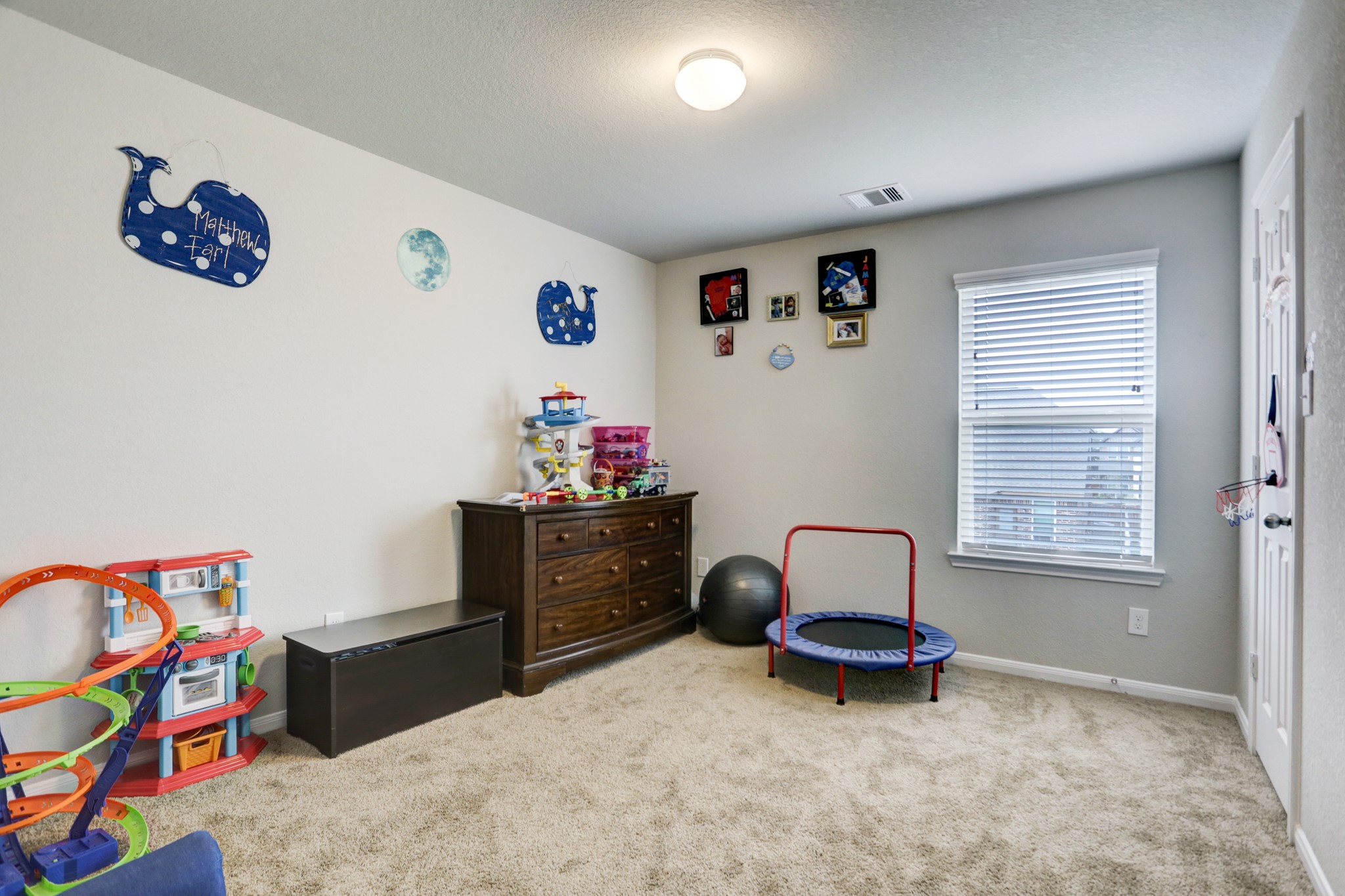 5414 Rustic Ruby Drive Fulshear, TX 77423 - Photo 11 of 26 Another one of the bedrooms is being used as a toy room. Great closet space.