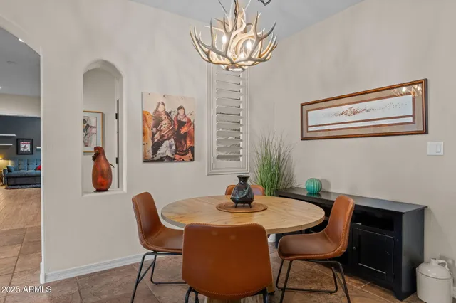 a dining room with furniture and window