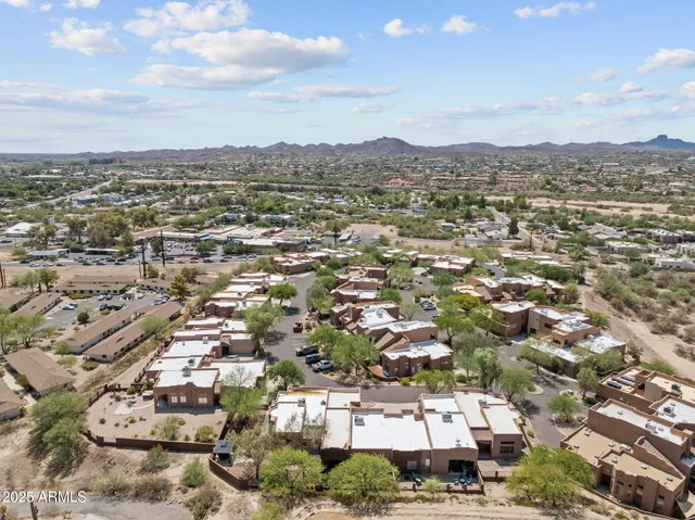 an aerial view of residential building with parking space