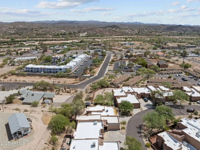 an aerial view of residential building and green space