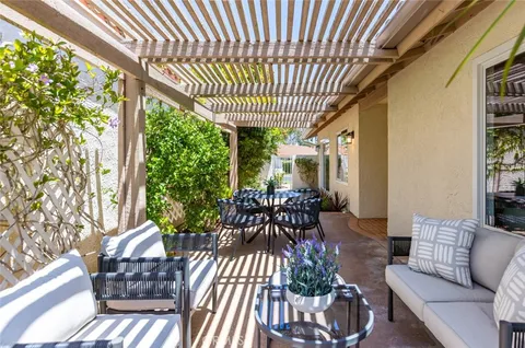 a outdoor living space with furniture and garden view