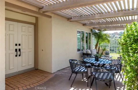 a view of a dining room with furniture and window
