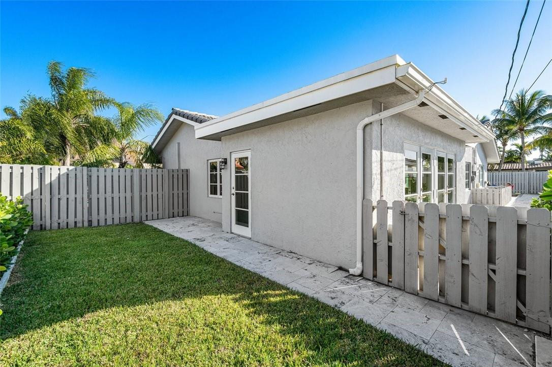 2610 Northeast 43rd Street Lighthouse Point, FL 33064 - Photo 29 of 35 Fenced play area/dog run off living room