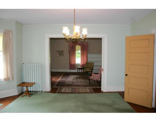 16 Spafford Road Milton, MA 02186 - Photo 7 of 17 a living room with fireplace furniture and a chandelier