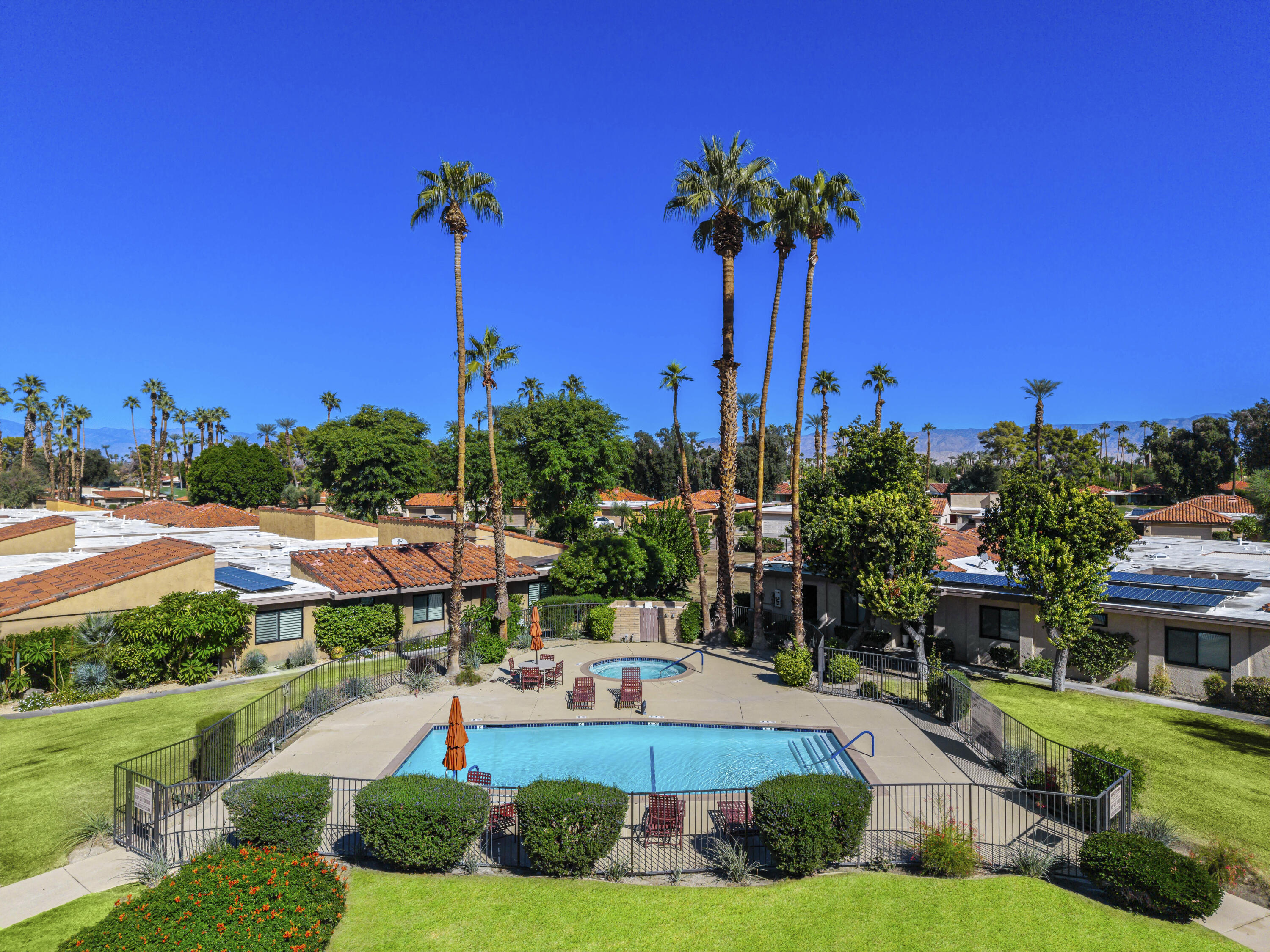38 Malaga Drive Rancho Mirage, CA 92270 - Photo 17 of 22 a front view of a building with garden