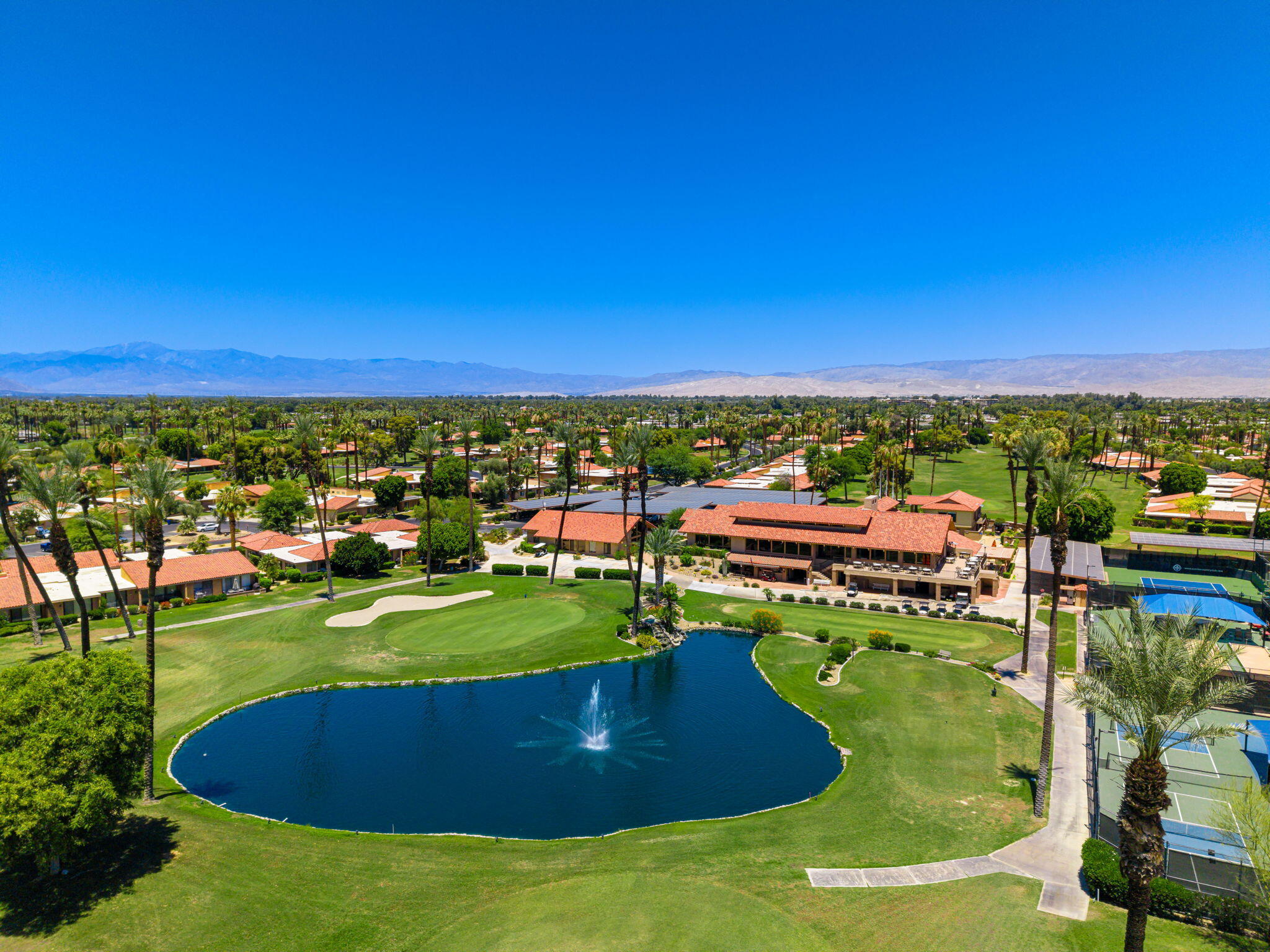 38 Malaga Drive Rancho Mirage, CA 92270 - Photo 20 of 22 a view of a lake with houses