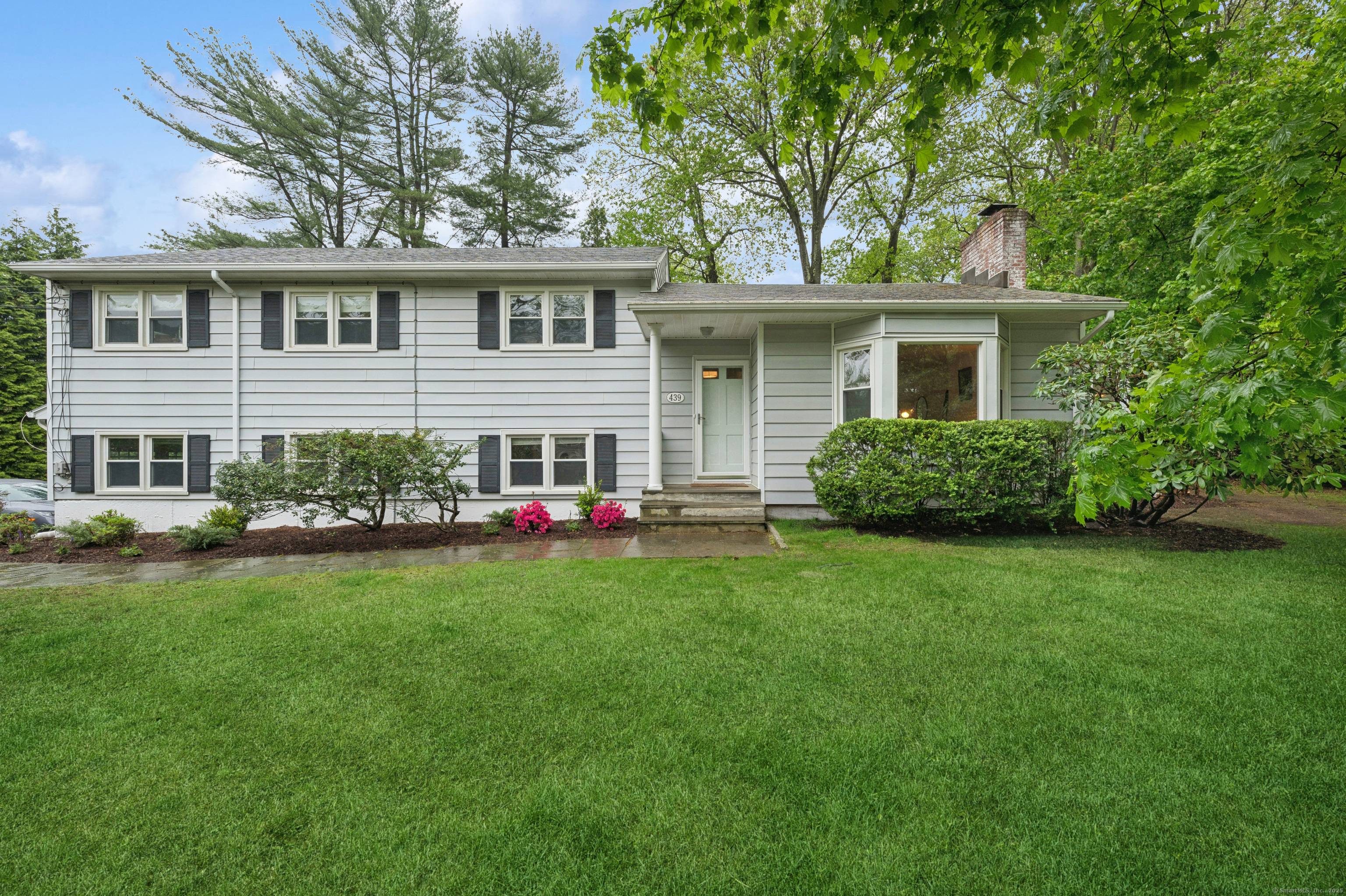 front view of a house with a yard