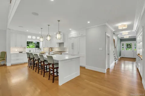 a view of a dining area with furniture window and wooden floor