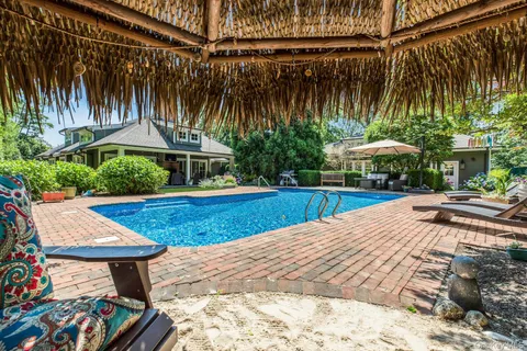 a view of swimming pool with a patio