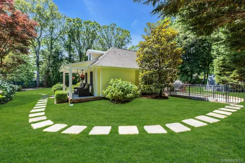 a view of a house with a yard porch and sitting area