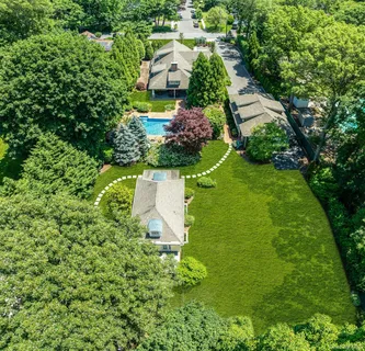 an aerial view of a house with a garden