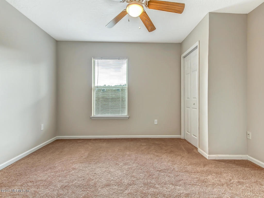 9158 Raptor Drive Jacksonville, FL 32221 - Photo 32 of 45 an empty room with windows