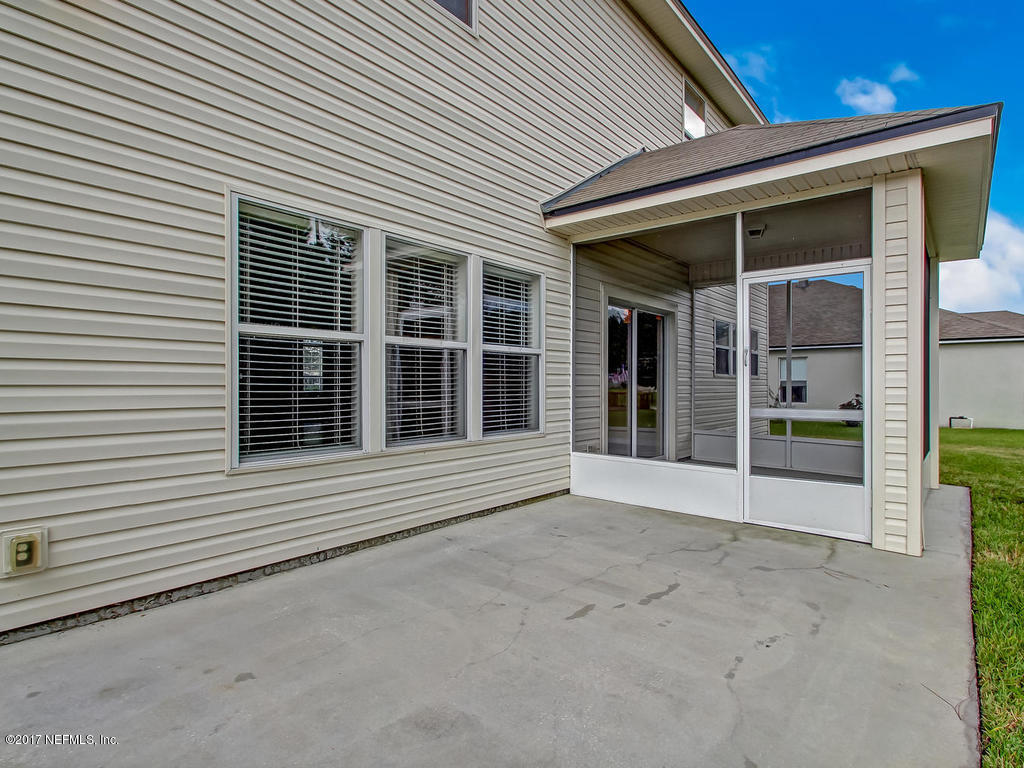 9158 Raptor Drive Jacksonville, FL 32221 - Photo 38 of 45 a view of a house with glass windows