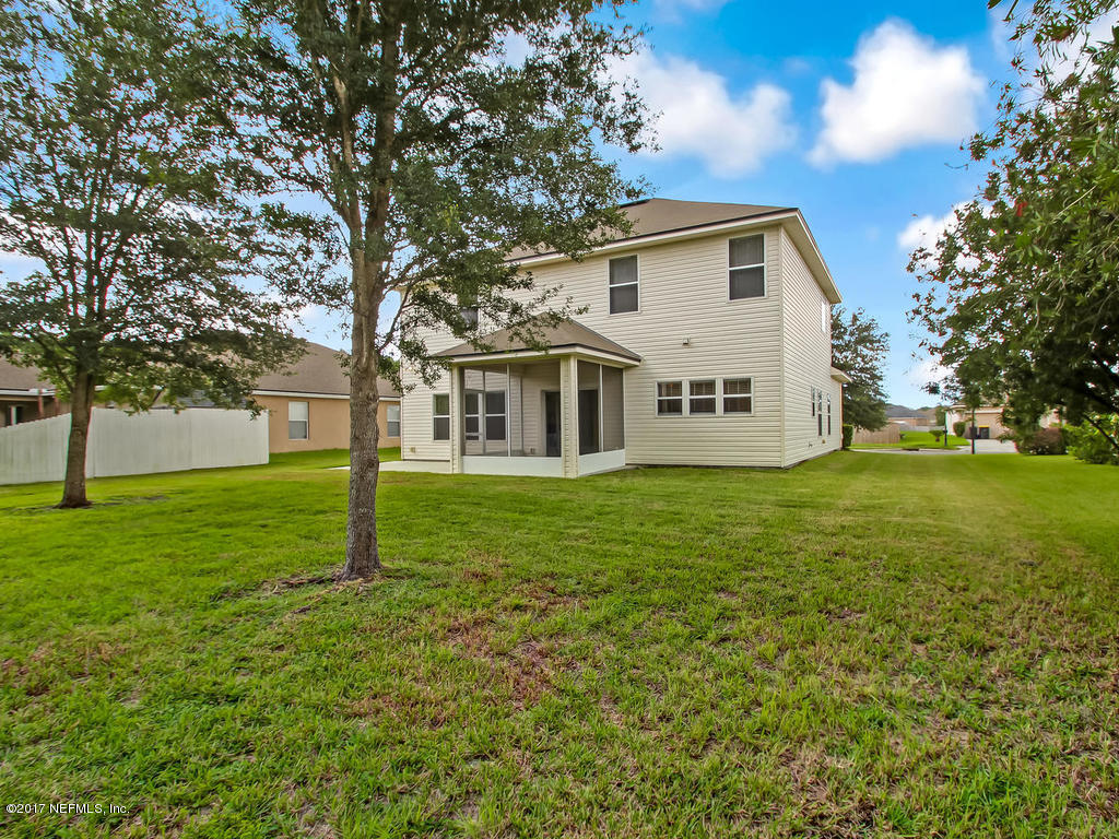 9158 Raptor Drive Jacksonville, FL 32221 - Photo 43 of 45 a house view with swimming pool