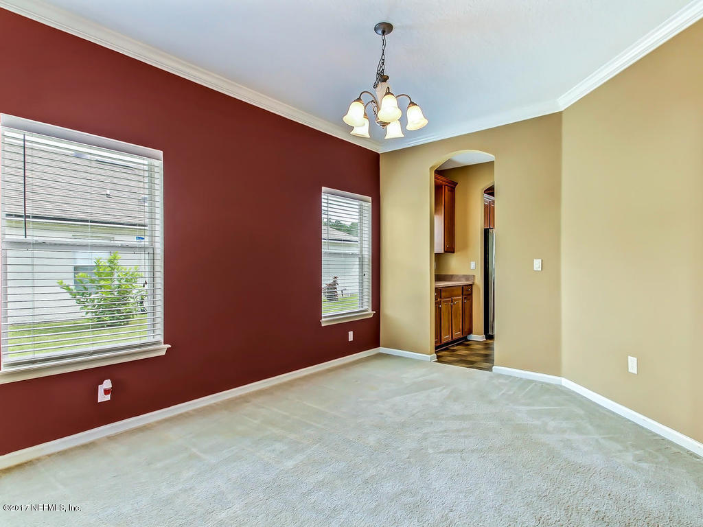 9158 Raptor Drive Jacksonville, FL 32221 - Photo 7 of 45 a view of a livingroom with a chandelier furniture and windows