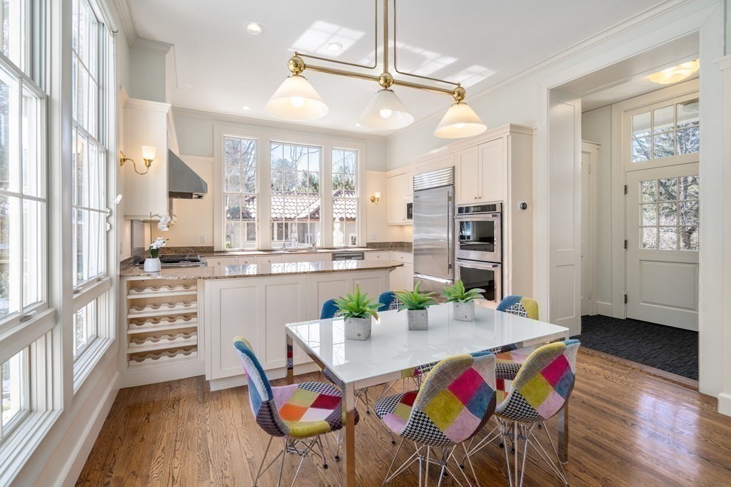 386 Commonwealth Avenue Newton, MA 02467 - Photo 12 of 28 a view of a dining room with furniture a chandelier and wooden floor