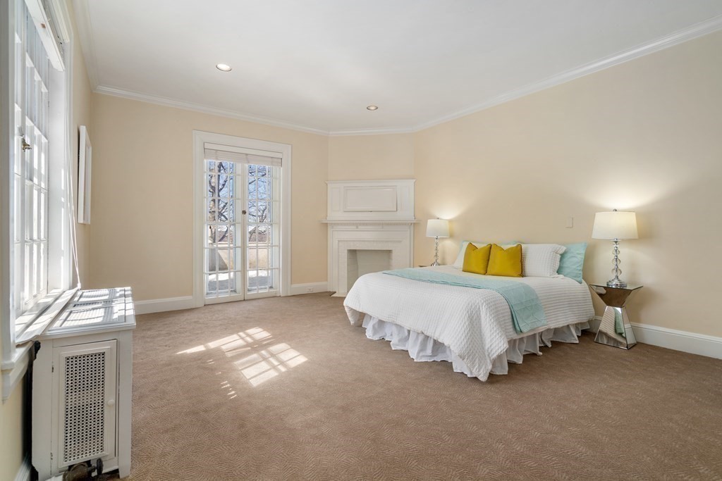 386 Commonwealth Avenue Newton, MA 02467 - Photo 18 of 28 a spacious bedroom with a bed and a window