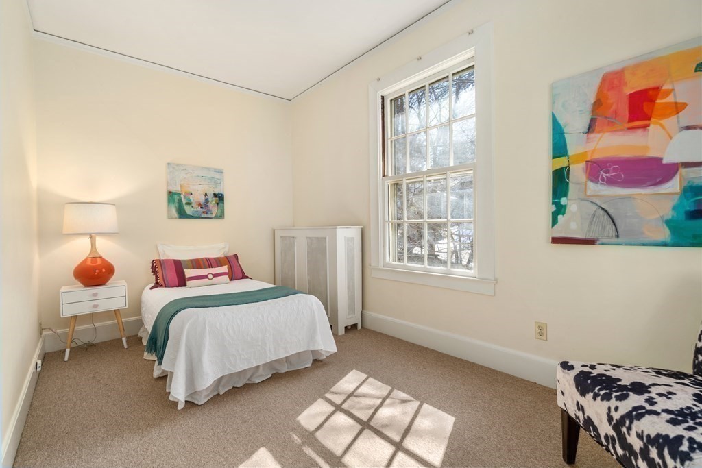 386 Commonwealth Avenue Newton, MA 02467 - Photo 21 of 28 a bedroom with a bed and a window