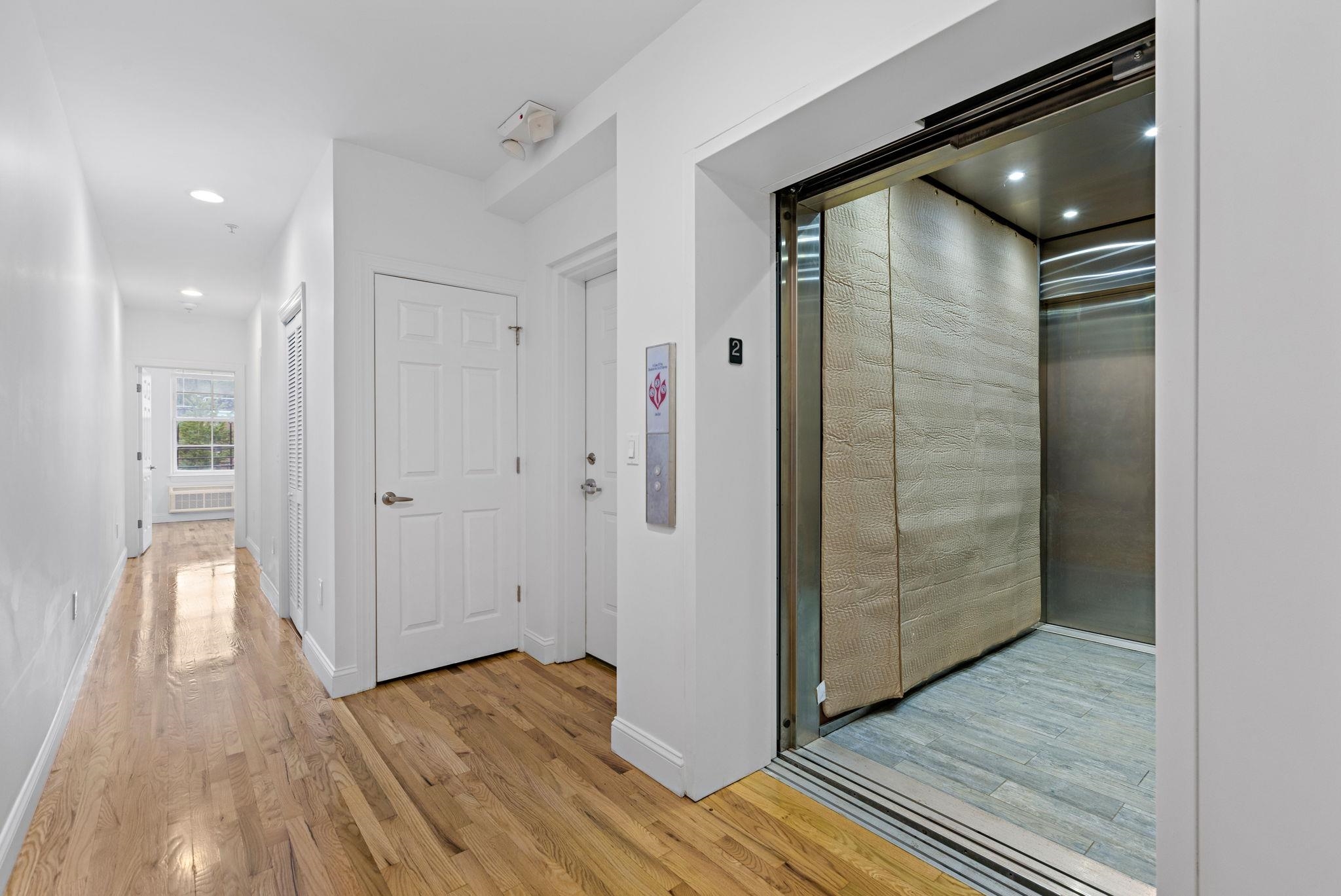 415 Jackson Street, Unit 1R Hoboken, NJ 07030 - Photo 5 of 14 a view of hallway with wooden floor