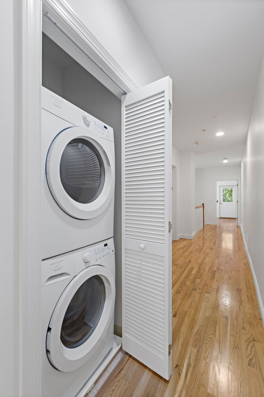 415 Jackson Street, Unit 1R Hoboken, NJ 07030 - Photo 9 of 14 a view of a hallway with washer and dryer