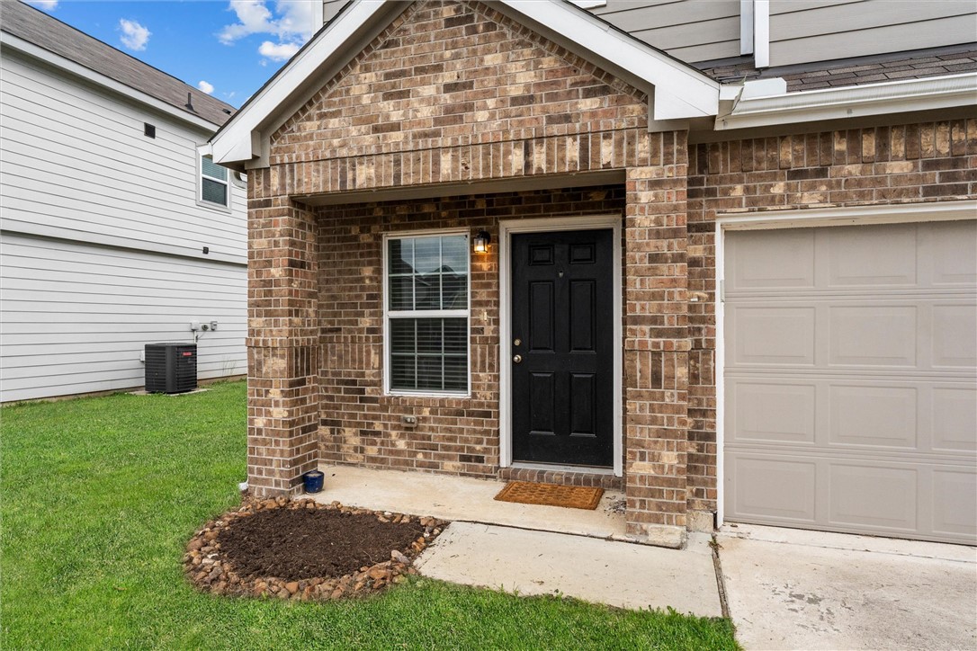 980 Rice Drive Bryan, TX 77803 - Photo 2 of 31 a view of brick house with a large window