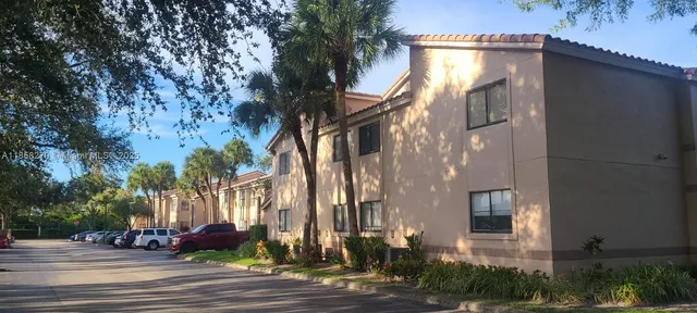 a kitchen with a sink cabinets and a window