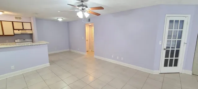 a view of a kitchen with a sink and a chandelier