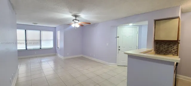 a view of a hallway with a large window