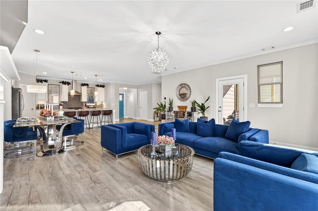 5259 Cloud Street Stone Mountain, GA 30083 - Photo 17 of 38 a living room with furniture and a chandelier