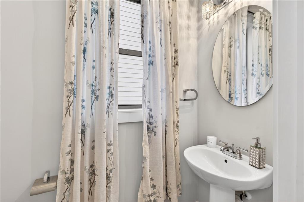 5259 Cloud Street Stone Mountain, GA 30083 - Photo 19 of 38 a bathroom with a sink and a mirror