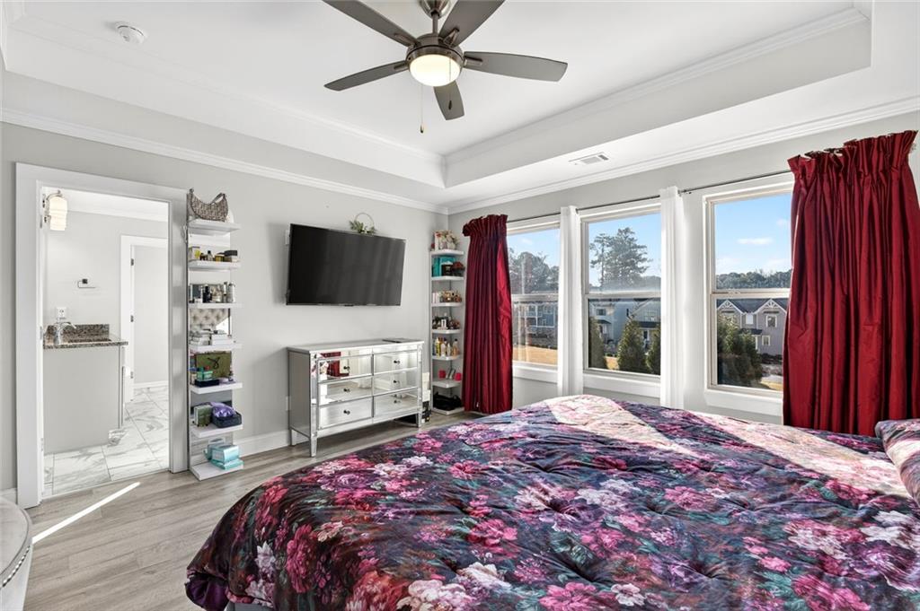 5259 Cloud Street Stone Mountain, GA 30083 - Photo 25 of 38 a bedroom with a bed and a flat screen tv