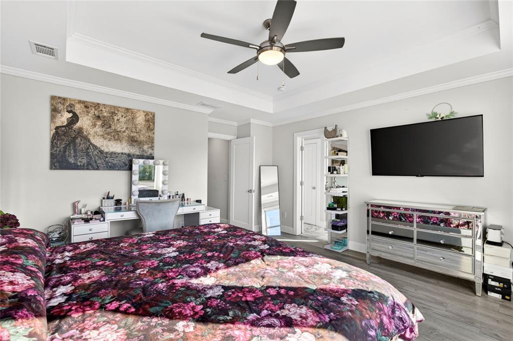 5259 Cloud Street Stone Mountain, GA 30083 - Photo 26 of 38 a bedroom with a bed and a flat screen tv