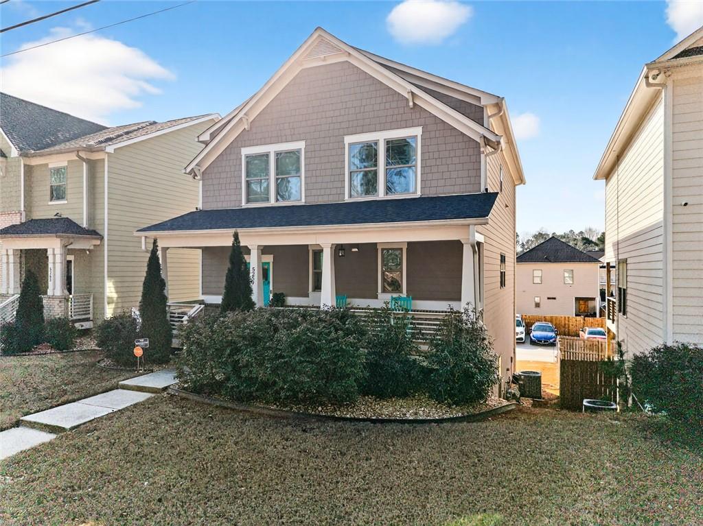 5259 Cloud Street Stone Mountain, GA 30083 - Photo 3 of 38 a front view of a house with a yard