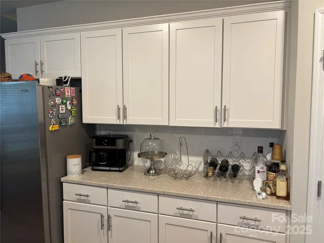 a kitchen with a cabinets and a window