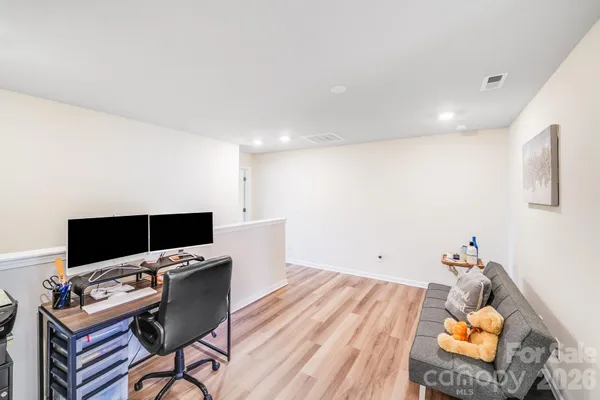 a room with furniture and a flat screen tv