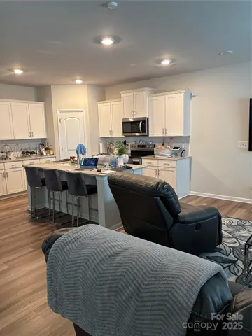 a kitchen with a sink appliances and cabinets
