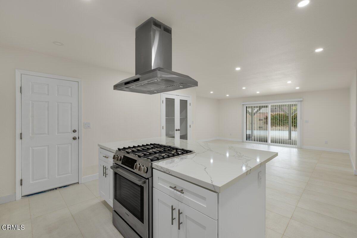 2075 Suner Circle Camarillo, CA 93010 - Photo 4 of 10 a kitchen with stainless steel appliances a stove and white cabinets