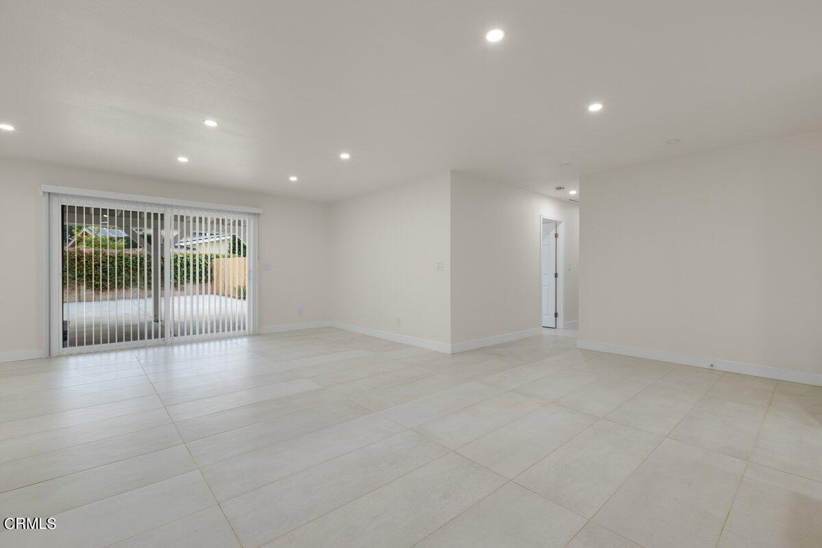2075 Suner Circle Camarillo, CA 93010 - Photo 5 of 10 a view of an empty room with wooden floor and glass door