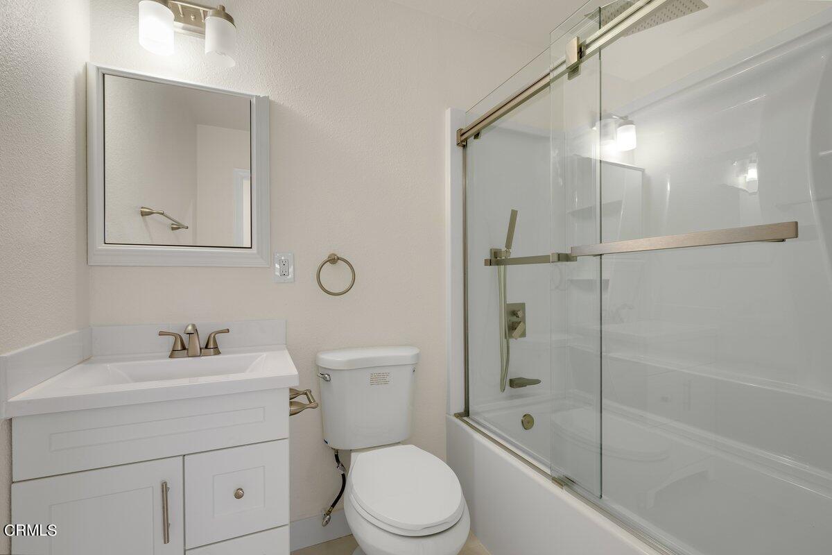 2075 Suner Circle Camarillo, CA 93010 - Photo 7 of 10 a bathroom with a toilet sink vanity and shower
