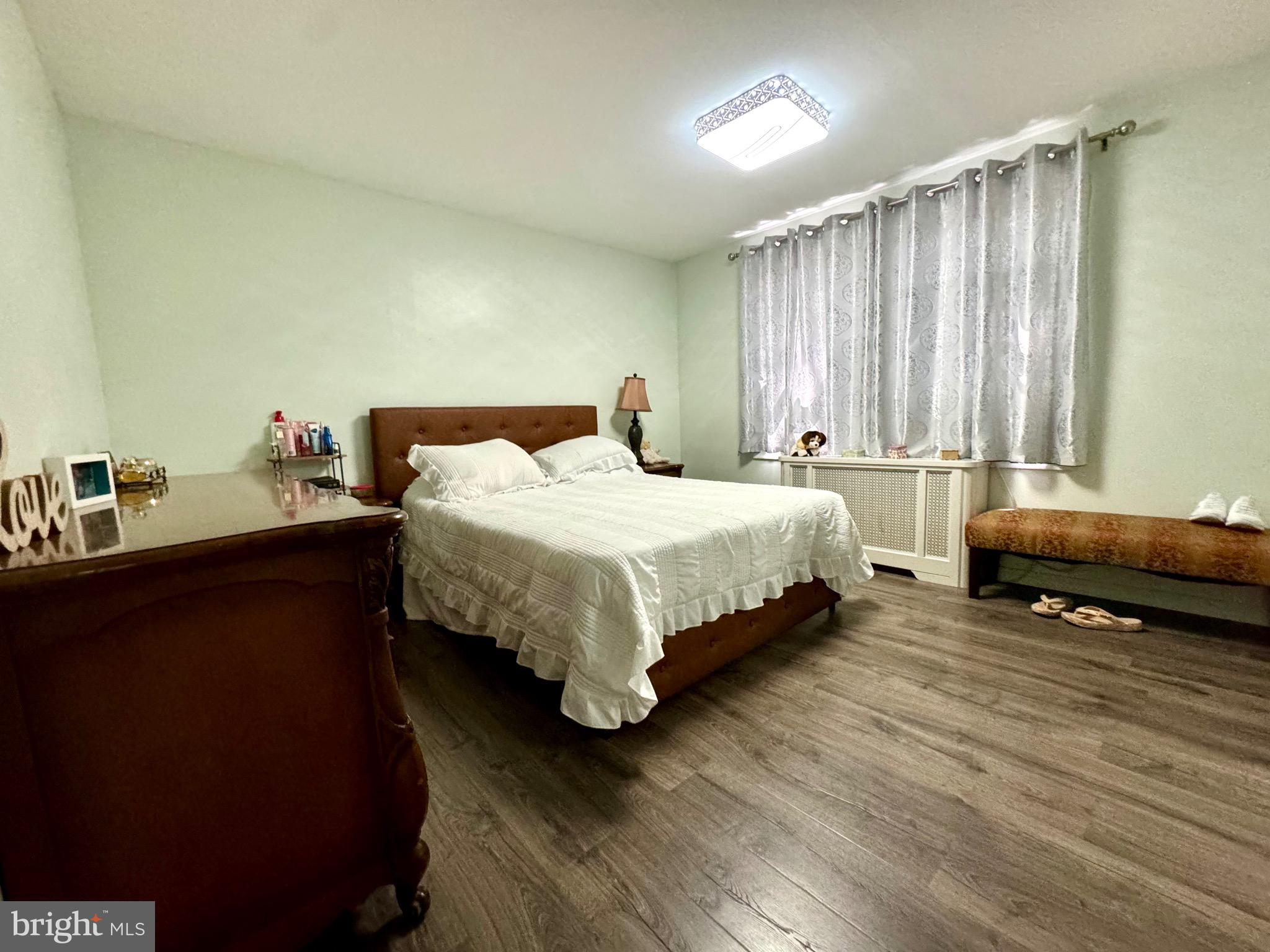 3335 Brighton Street Philadelphia, PA 19149 - Photo 12 of 24 a bedroom with a bed and a large window