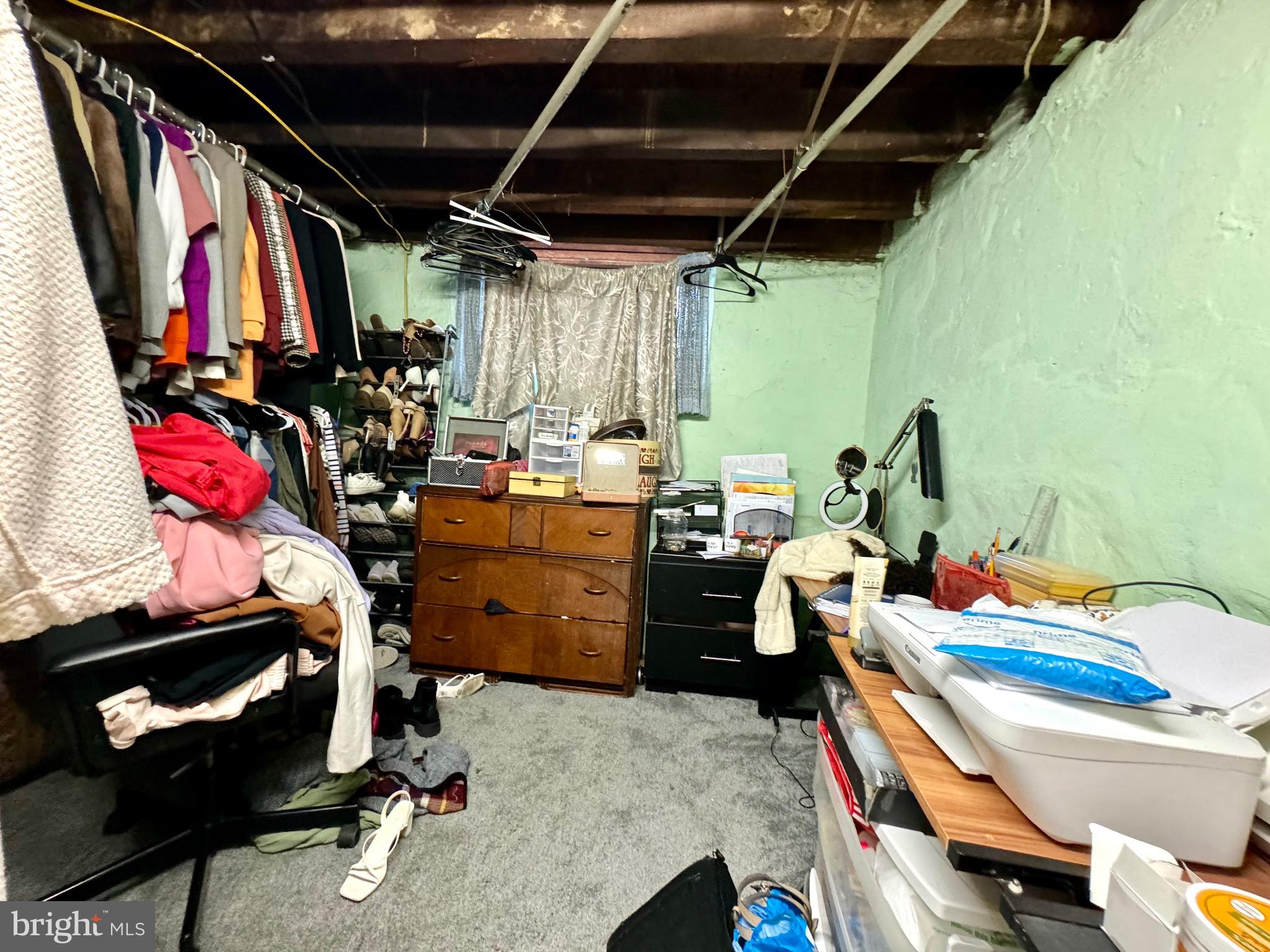 3335 Brighton Street Philadelphia, PA 19149 - Photo 22 of 24 a view of walk in closet with clothes and shoes