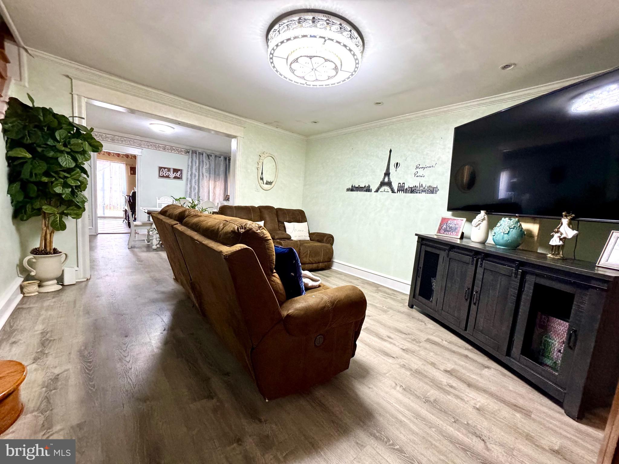3335 Brighton Street Philadelphia, PA 19149 - Photo 3 of 24 a living room with furniture and a flat screen tv