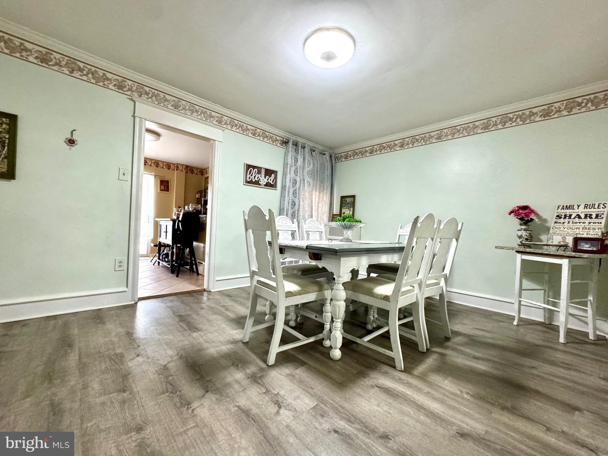 3335 Brighton Street Philadelphia, PA 19149 - Photo 4 of 24 a dining room with furniture and wooden floor