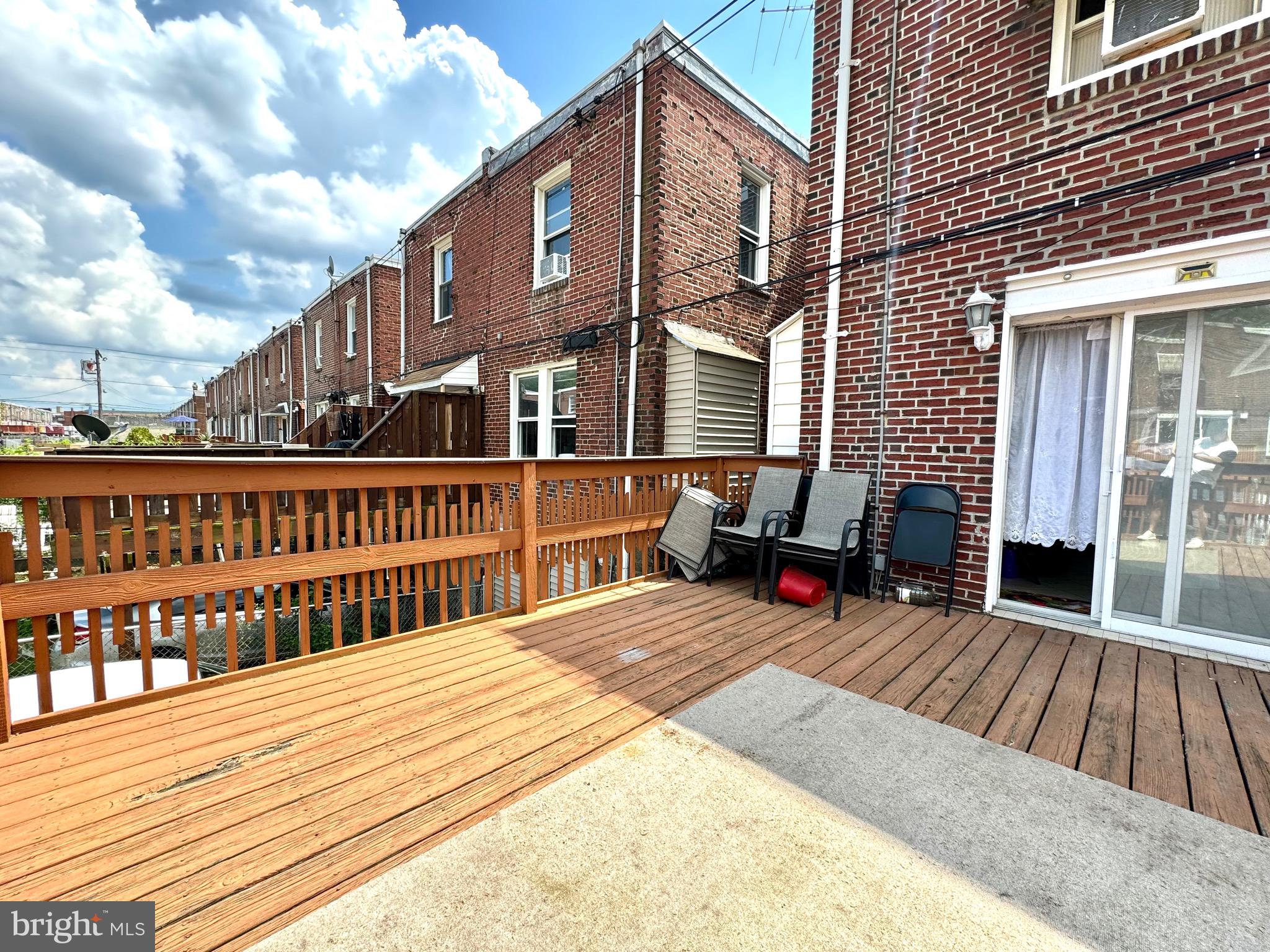 3335 Brighton Street Philadelphia, PA 19149 - Photo 9 of 24 a balcony with wooden floor and furniture