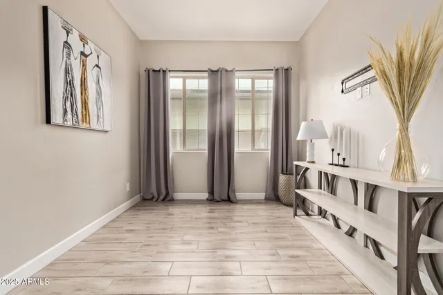 a view of an entryway with wooden floor