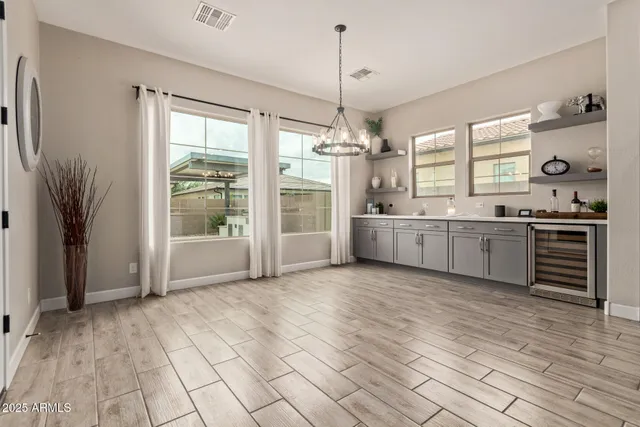 a view of a kitchen with a sink and windows