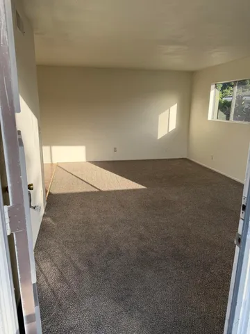 view of an empty room with a window